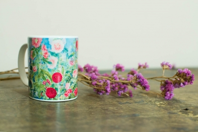 Coffee Mug. Flowers behind the Fence